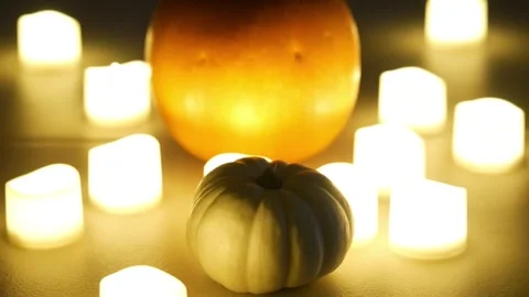 Pumpkins with candles flickering around them. Static shot. Halloween season Stock Footage 253829493