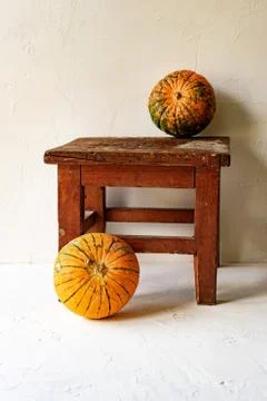 Pumpkins on a chair Stock Photos