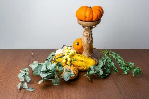 Pumpkins composition for autumn whit white background and wooden table Stock Photos