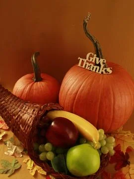 PUMPKINS, CORNUCOPIA - HORN OF PLENTY FILLED WITH FRUIT Stock Photos