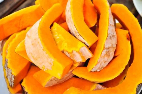 Pumpkins cut in pieces Stock Photos