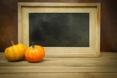 Pumpkins with Empty Chalk Board Stockfoto's