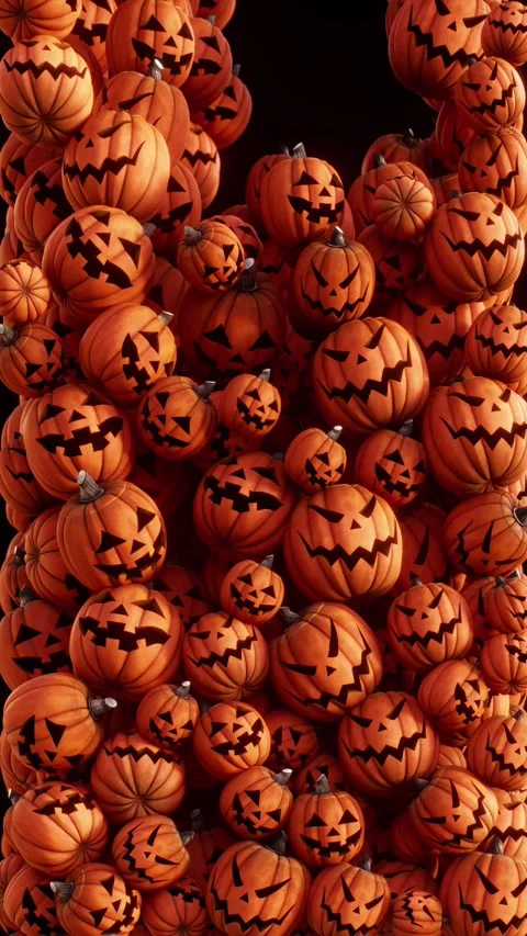 Pumpkins fill the screen as they fall, fun mood for a Halloween, vertical Stock Footage 345523247