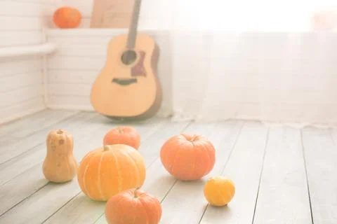 Pumpkins on the floor in the room Stock Photos
