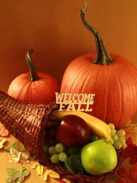 PUMPKINS, fruit filled cornucopia, Halloween/THanksgiving holidays Stock Photos