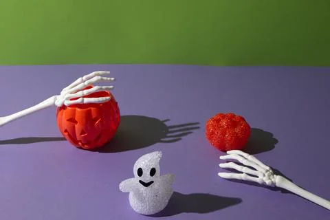 Pumpkins for Halloween with a ghost with hand. Stock Photos