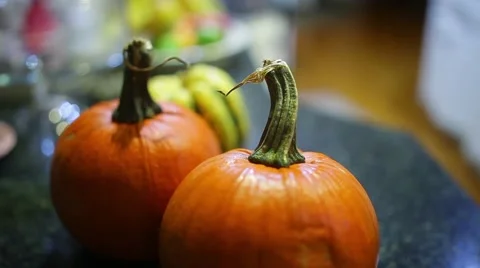 Pumpkins harvest put on counter Stock Footage 56918389