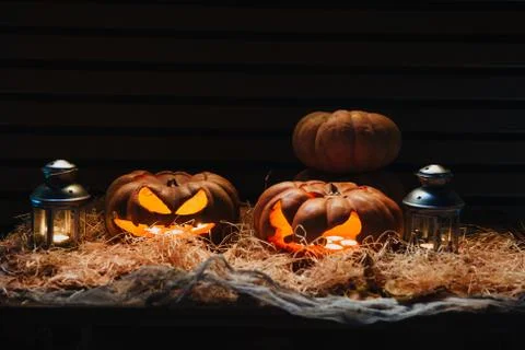 Pumpkins lie on the straw Stock Photos