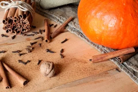 Pumpkins, nuts on table frame with empty space Stock Photos