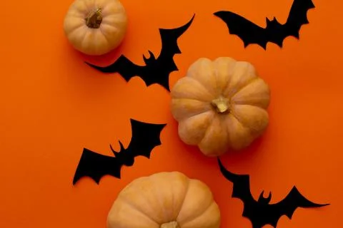 Pumpkins on orange table. Halloween background Stock Photos