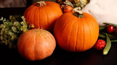 Pumpkins, peppers, corn evoke vibrant harvest scene. Cozy seasonal atmosphere Stock Photos