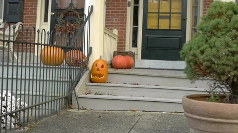 Pumpkins on the porch with a tree in the foreground. Stock Footage 49101725