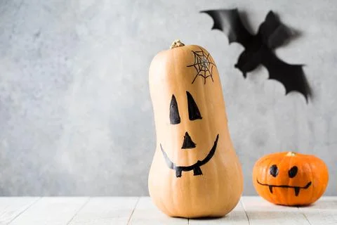 Pumpkins with spooky faces on table at Halloween celebration Foto stock