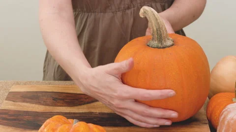 Pumpkins, squash, butternut squash close up  on wooden board Stock Footage 149384806