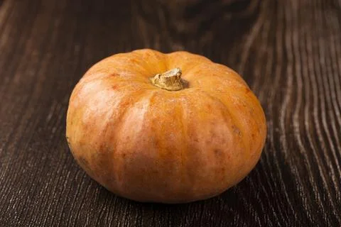 Pumpkins on the wooden table. Stock Photos