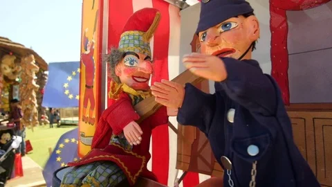 Punch and policeman puppet with EU flags in the background Stock Footage 84650961