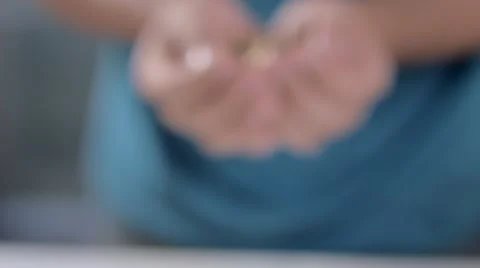 A punch of coin in a man hand Видео 58510604