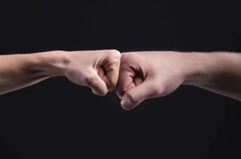 A punch or force of five is a gesture of respect or approval. A greeting with Stock Photos