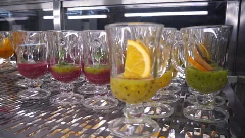 Punch preparations in mugs, standing in a row. Stock Footage 306245942