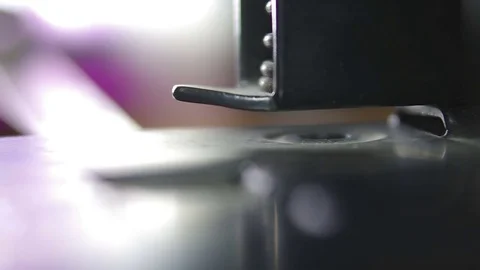 The puncher does a hole in the sheet of paper (macro) Stock Footage 81787142