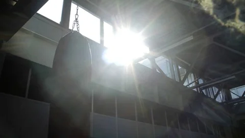 Punching bag hanging in sunlight 스톡 동영상 77878424