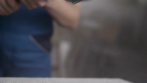 Punching a rock with a hammer Stockbeeldmateriaal 91546887