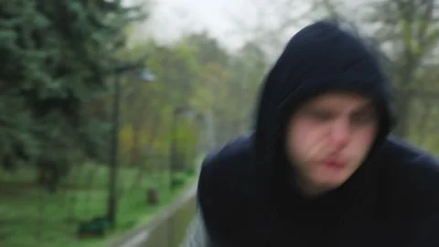 Punching Through the Storm A Boxer's Dedicated Workout Despite the Rain Stock Footage 237893306