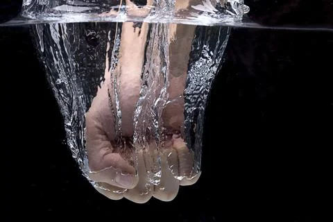 Punching into the water. Stock Photos