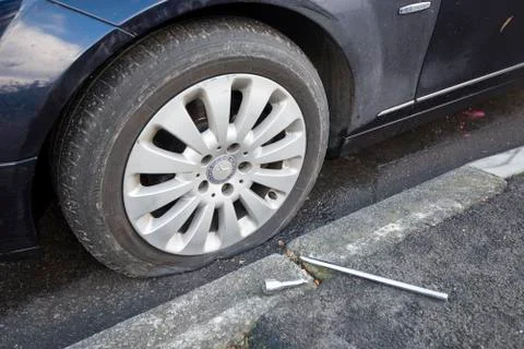 Puncture and broken spanner Stock Photos