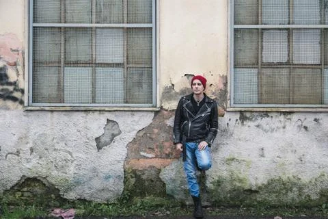 Punk guy posing in the city streets Stock Photos