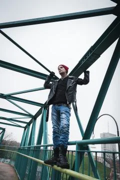 Punk guy standing on a bridge Stock Photos