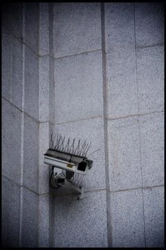 Punk hostile surveillance camera Stock Photos