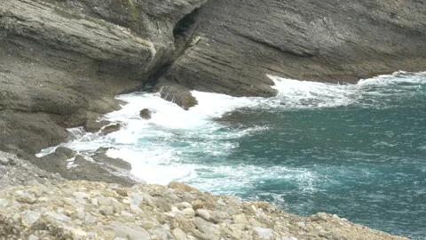 Punta Chiappa : Powerful waves break on the rocky cliff Stock Footage 169484786