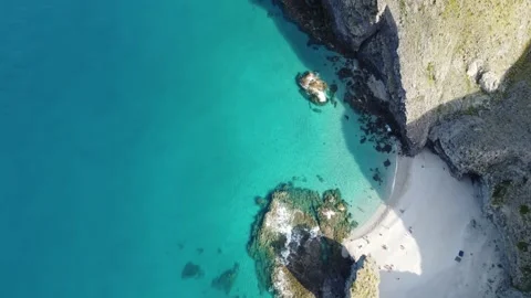 Punta de Los Muertos beach, Almeria. Drone looking down at white sandy cove Stock Footage 201775589