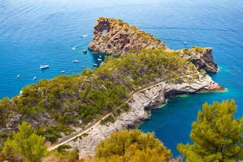 Punta de Sa Foradad and boats at gulf in Mallorca, Spain Stock Photos