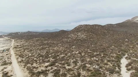 PUNTA GORDA BEACH BCS MEXICO-2023: An Aerial View Of A Dirt Road In The Desert Stock Footage 245844900