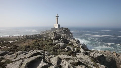 Punta Nariga Lighthouse in Spain at summer day Stock Footage 87649476