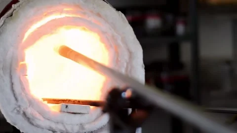 Punty heating up in glory hole. Stock Footage 148153164