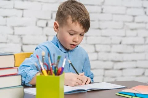 Pupil doing homework having an idea Stock Photos