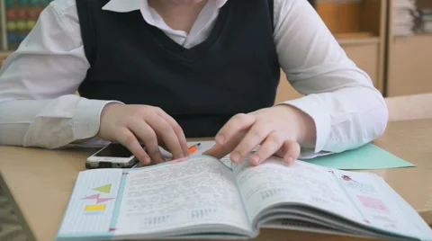 Pupil flips pages of tutorial during the lesson Stock Footage 69001517