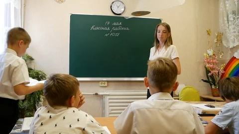 Pupil going to the blackboard Stock Footage 93889755