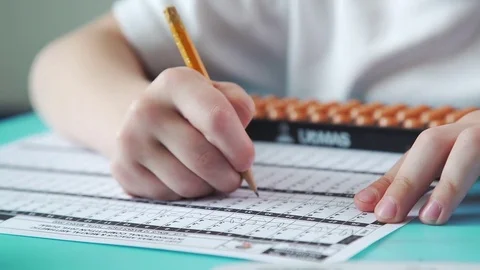 Pupil is healed by mental arithmetic, using special scores. Stock Footage 79522969
