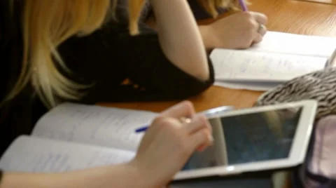 The pupil performs the task with the tablet Stock Footage 62321107