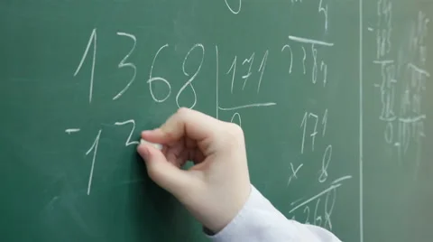 A pupil solves math on the chalkboard at primary school, Full HD shot Stock Footage 62529211