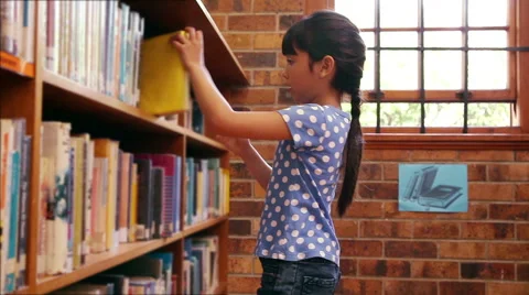 Pupil taking book from shelf at the library Stock Footage 49151353