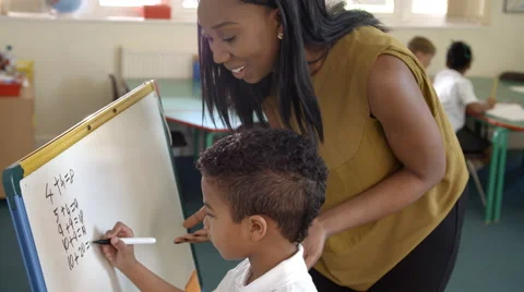 Pupil Writes Answer To Maths Problem On Board Shot On R3D Stock Footage 67344267