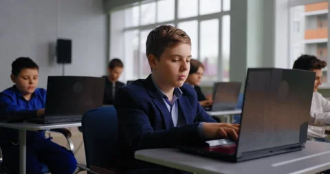 Pupils In Coding Classic, Portrait Of School Students Working With Laptops In Stock Footage 280176435