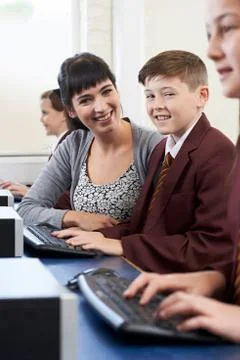 Pupils In Computer Class With Teacher Stock Photos