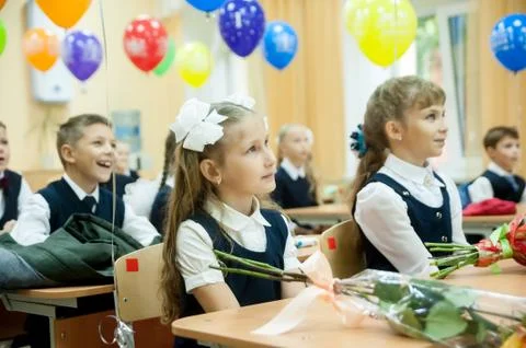 Pupils of elementary school in classroom Stock Photos