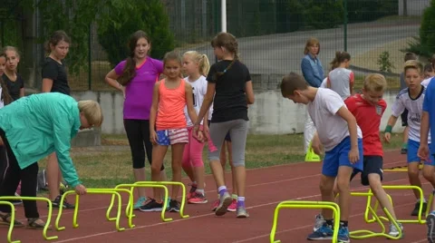 Pupils of the First Classes Trains on a Racetrack Stock Footage 68597308